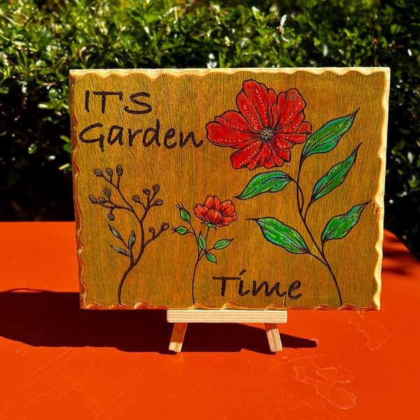 It's Garden time. Wooden sign. 