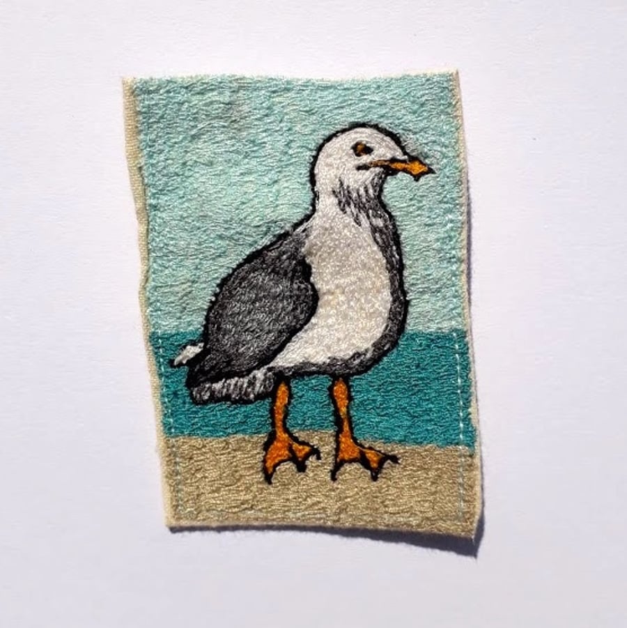 Seagull stitched brooch.