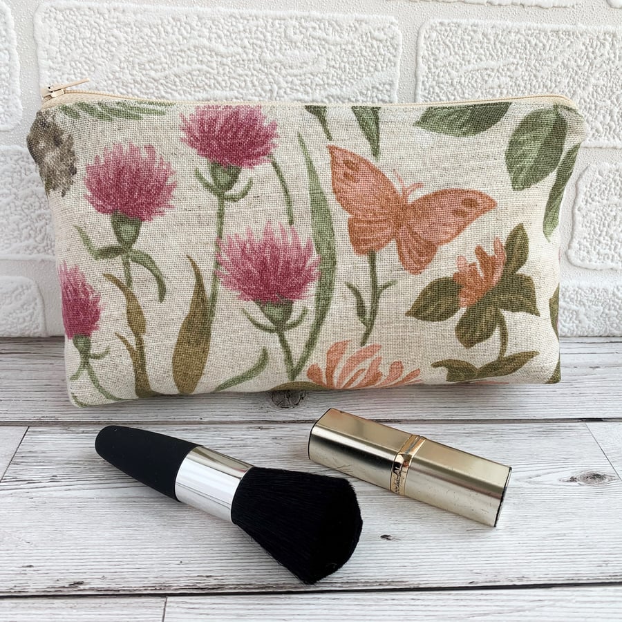 Make up bag, cosmetic bag with orange butterfly amongst honeysuckle and clover