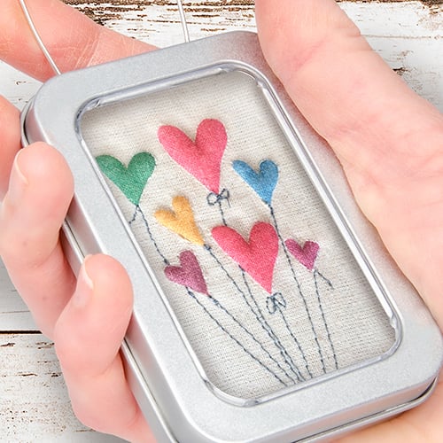 Coloured hearts, balloon heart gift, hearts framed in tin