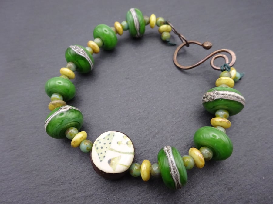 green toadstool lampwork glass bracelet