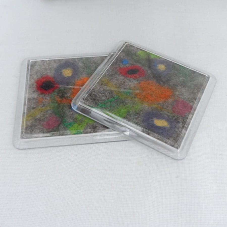 Felted flower coasters with acrylic casing
