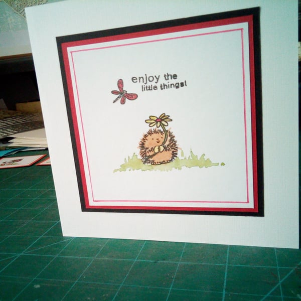 Cute hedgehog with flower birthday card 