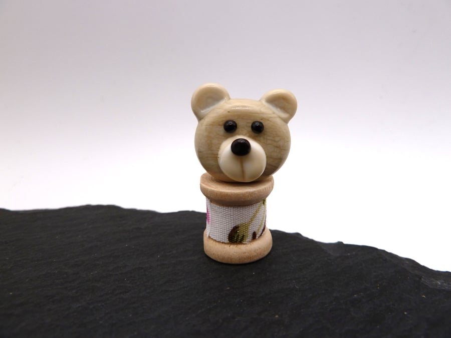small glass bobbin, teddy bear