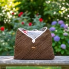 Paper raffia knit sling bag.
