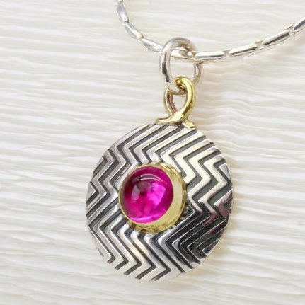 Zigzag sterling silver pendant, handmade featuring a pink Corundum gemstone. 