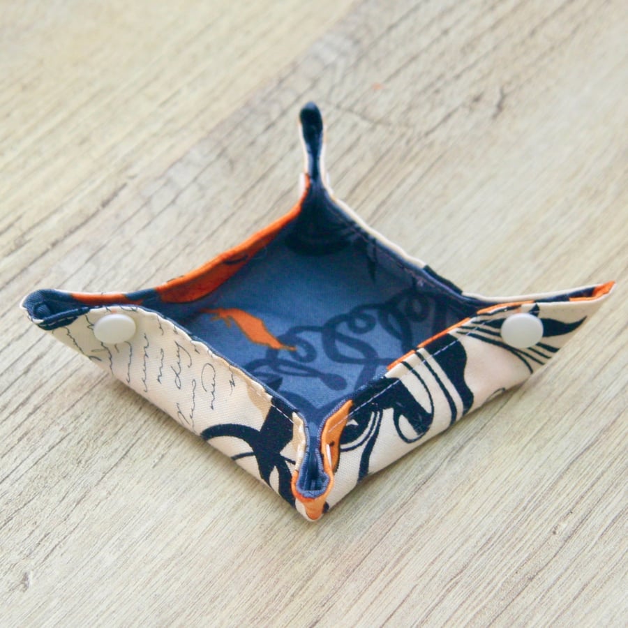 Small storage box featuring pumpkins and swirls