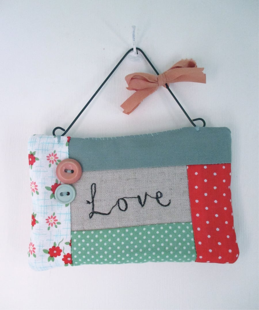 'Love' Hanging Quilted Fabric Quote with Button Decoration
