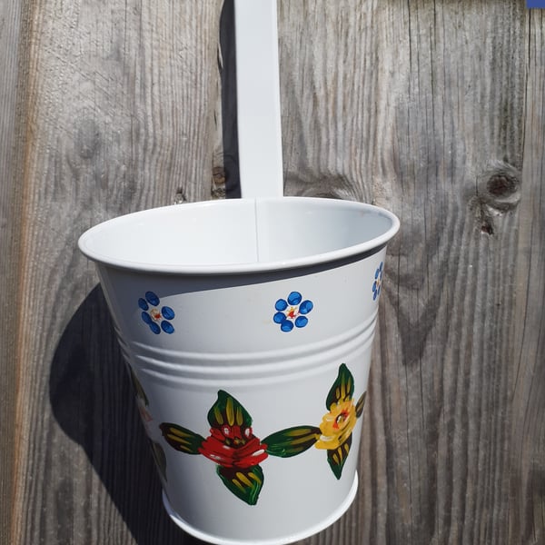 Round hanging planter handpainted with canal art style roses and daisies