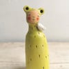 Ceramic miniature figurine Peculiar Person in bright green and bird