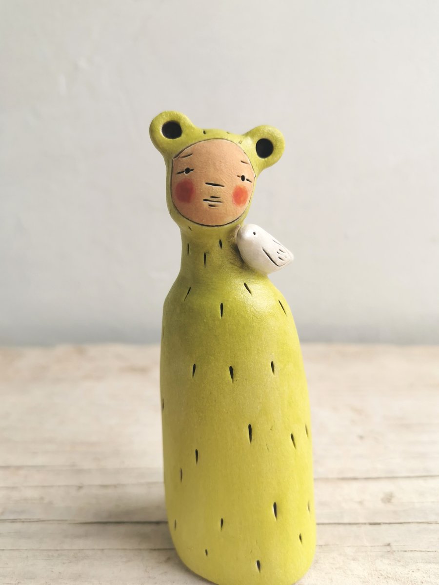 Ceramic miniature figurine Peculiar Person in bright green and bird
