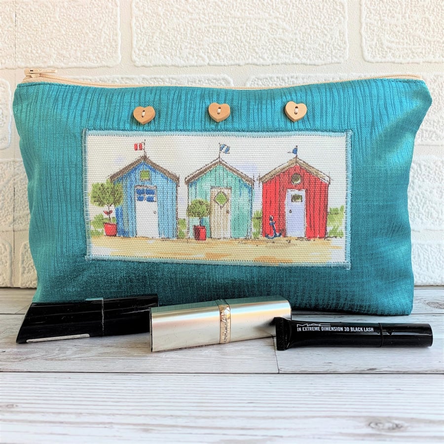 Large turquoise make up bag with beach huts decorative panel