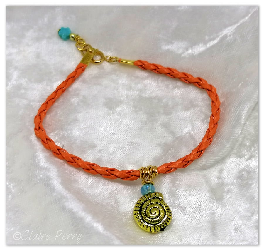 Bracelet Orange Faux Leather with gold plated Seashell charm bead.