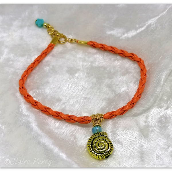 Bracelet Orange Faux Leather with gold plated Seashell charm bead.