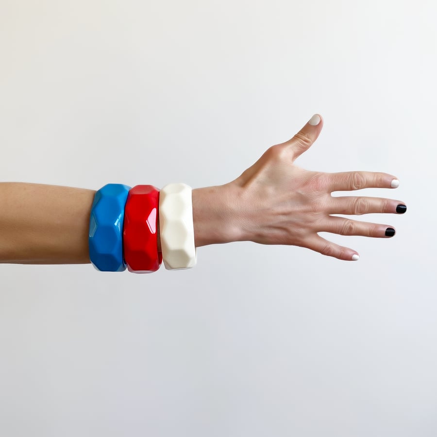 Geometrical chunky statement bangles cast in bright colours