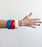 Geometrical chunky statement bangles cast in bright colours