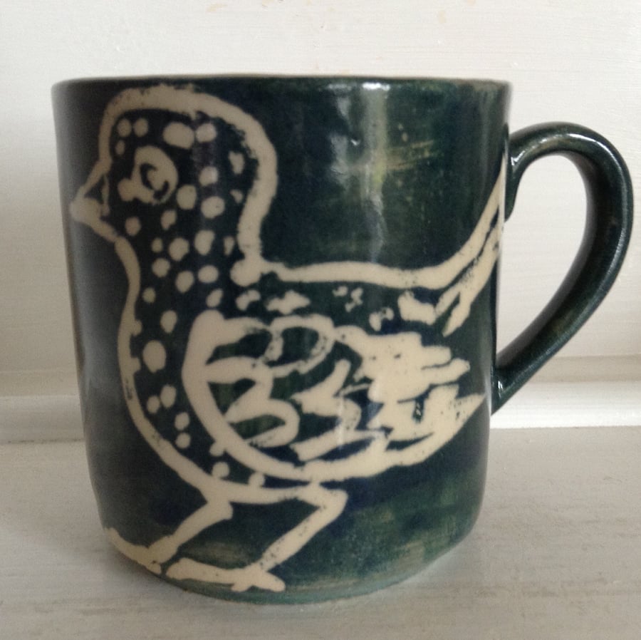 Stoneware mug with bird motif