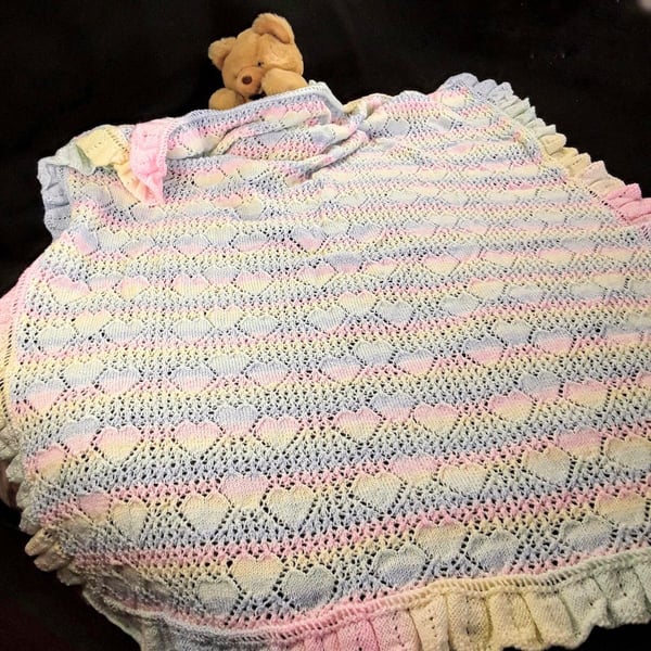 Hand knitted large baby shawl with hearts in pastel stripes 