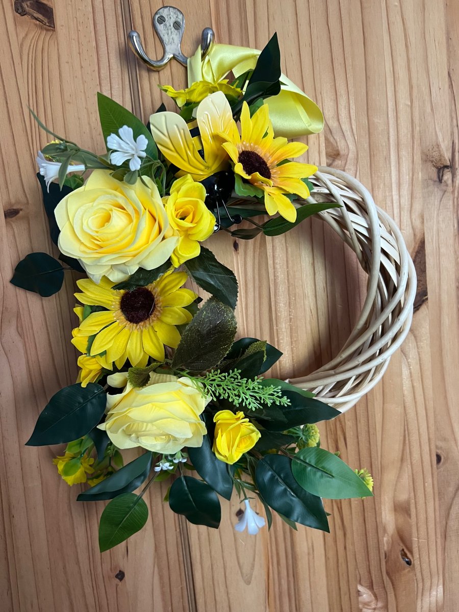 Yellow wicker door wreath