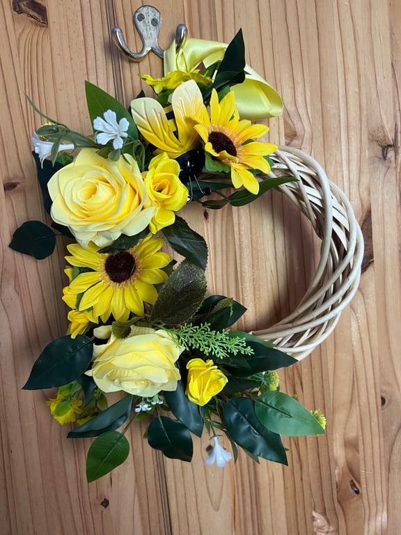 Yellow wicker door wreath