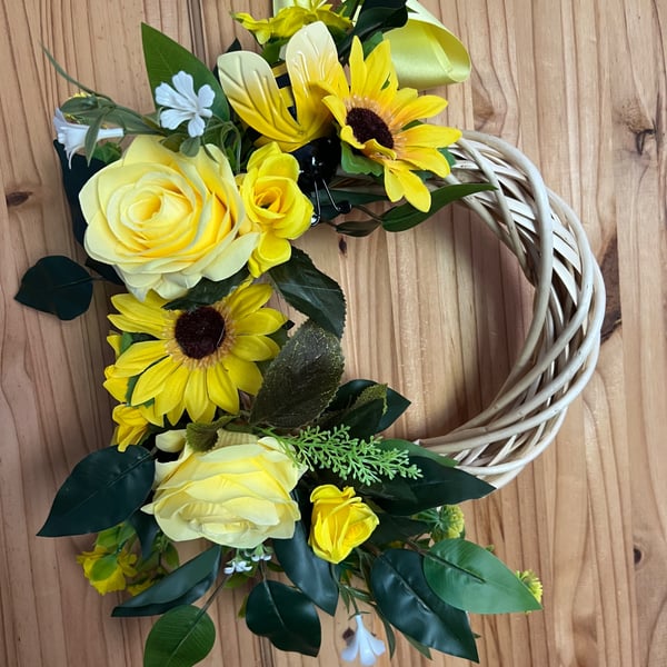 Yellow wicker door wreath