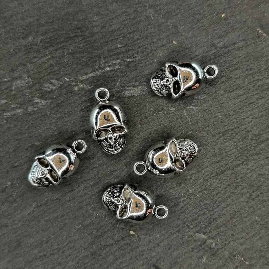 5 Skull charms antique silver tone