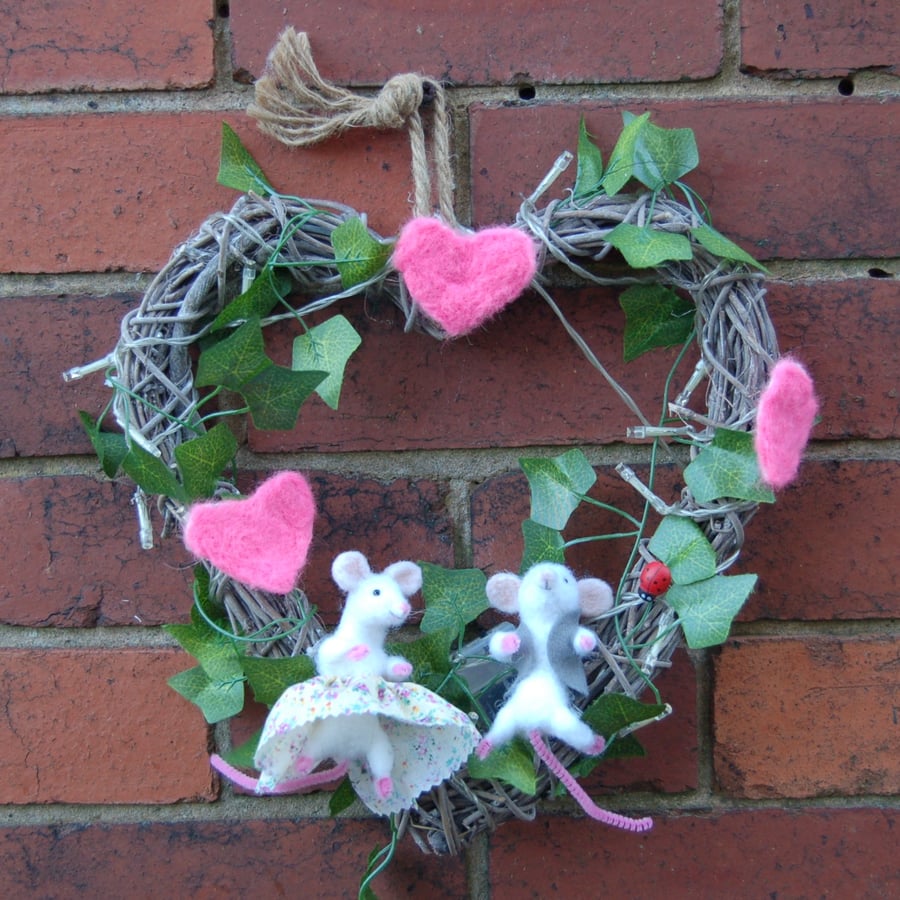 Rustic wood wreath decorated with Needlefelt mice, hearts, fairy lights