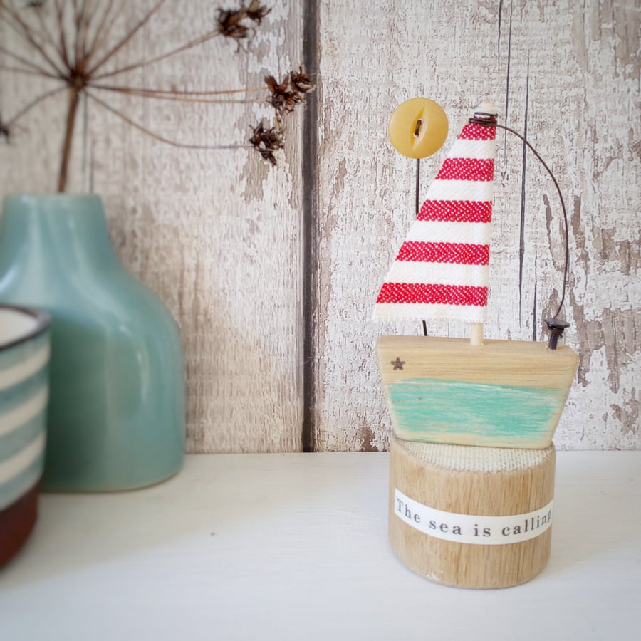 Handmade little wooden sail boat with sunshine button 'The sea is calling'