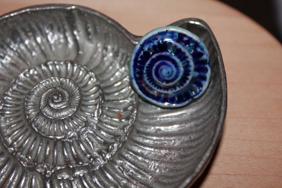 Handmade ceramic ammonite brooch in blue & mother of pearl lustre