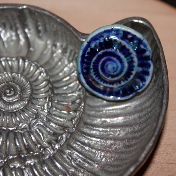 Handmade ceramic ammonite brooch in blue & mother of pearl lustre