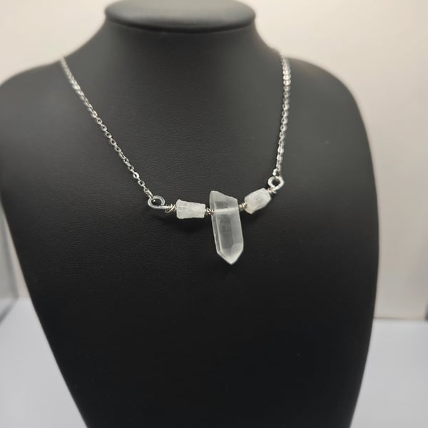 Necklace with wire wrapped clear quartz crystal pendant