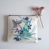 Zipped pouch made from a vintage embroidery butterfly and flowers design.