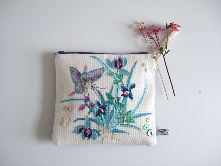 Zipped pouch made from a vintage embroidery butterfly and flowers design.