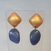 Mid blue and gold coloured drop earrings.
