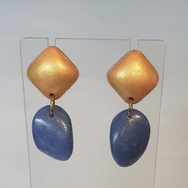 Mid blue and gold coloured drop earrings.