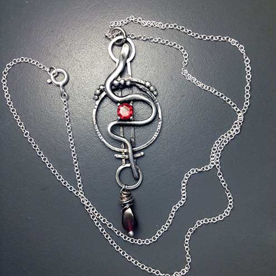 Silver and Garnet snake pendant