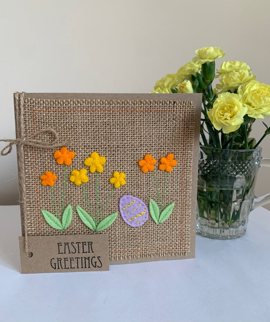 Easter greeting card with flowers and lilac decorated egg. Handmade. Wool felt.