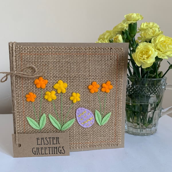 Easter greeting card with flowers and lilac decorated egg. Handmade. Wool felt.