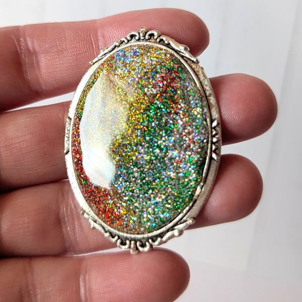 Large oval tibetan silver firestone brooch.