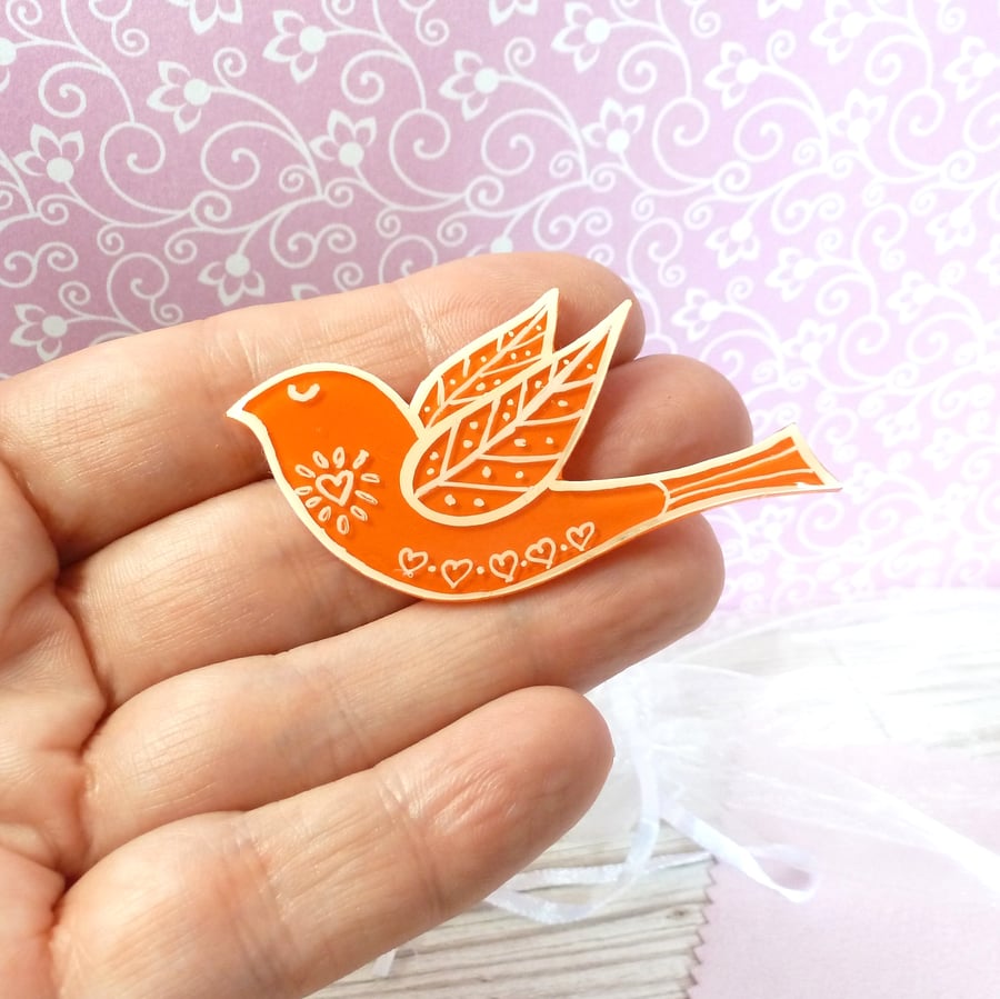 Orange folk art style bird jacket pin. Bright orange handmade lapel pin 