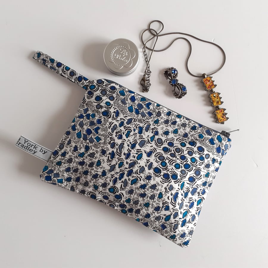 Liberty remnant make up bag or purse in a blue ditsy print.