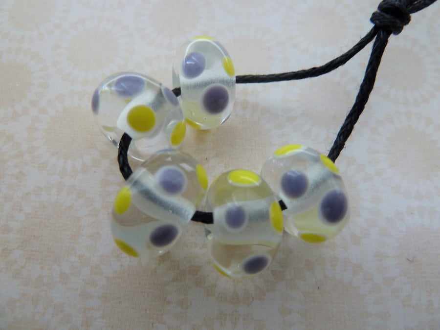 handmade yellow and purple spot lampwork glass beads