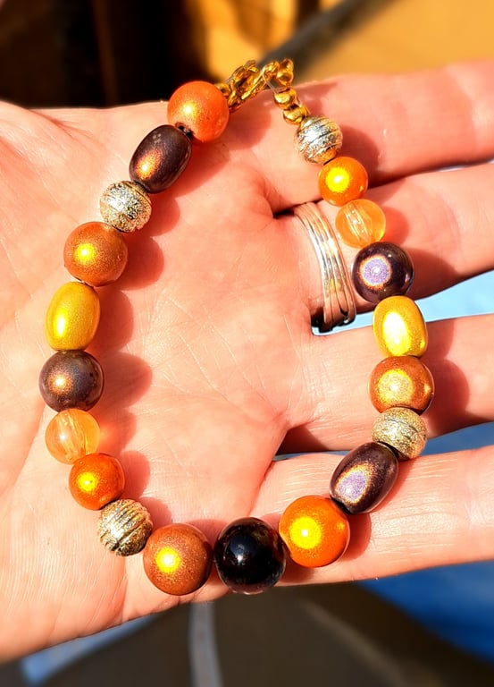 Yellow, orange, brown disco beaded bracelet with spacers and lobster clasp