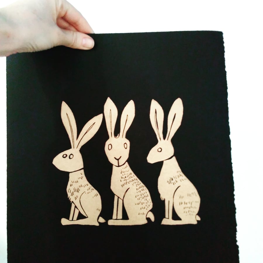 Gold Hare Trio - lino cut print