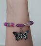 Elasticated pastel goth beaded bracelet with skull and butterfly charm - Image 3