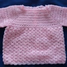 Pink crochet baby jumper. Pretty lacy baby jumper