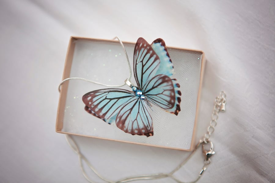 Blue silk butterfly necklace with silver plated chain and Swarovski Crystals.
