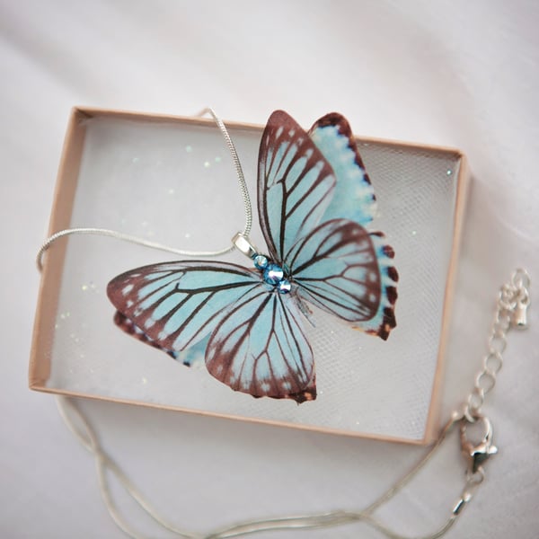 Blue silk butterfly necklace with silver plated chain and Swarovski Crystals.