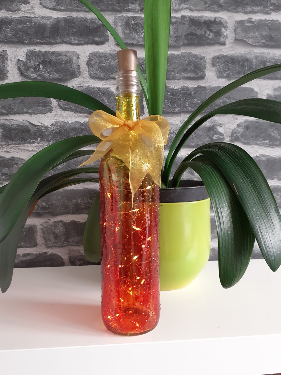 Bottle lamp in flame colours, red orange yellow bottle lamp