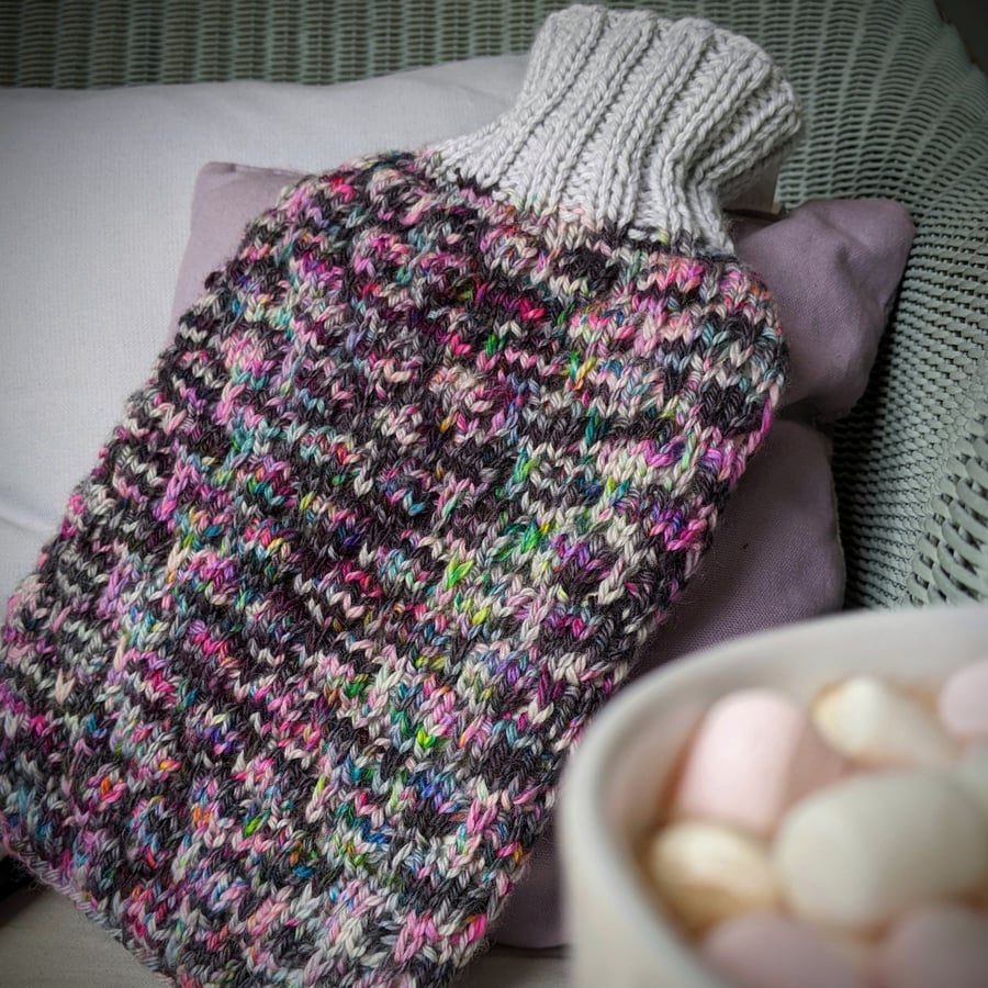 Speckled knitted hot water bottle cover